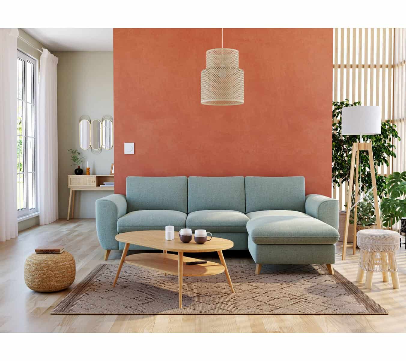 Canapé design bleu turquoise avec angle, salon moderne et lumineux.